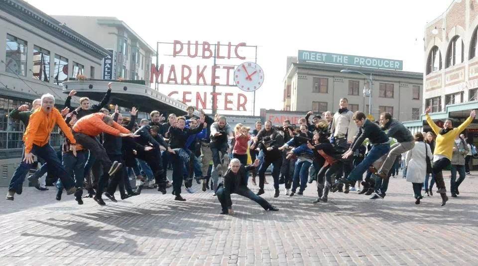 "Fist of God(man)" is a company photo from October 15, 2013. The guy in the yellow sweater on the right was not an employee. Lol.